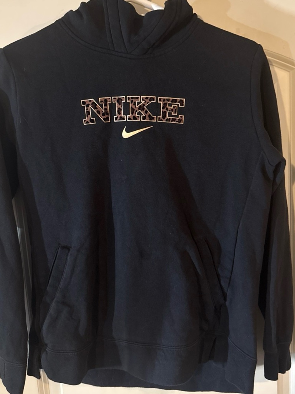 Nike Kids Navy Hoodie with Leopard Outline Logo and White Swoosh